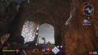 East: On the other side of the archway.
