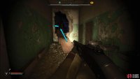 Go through the hole in the wall and climb the ladder to your left.