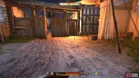 Make your way across the square and through this gate.