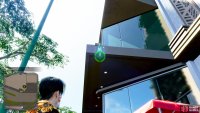 Look for this slight overhang on the building with the large, glass windows.