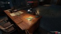 Grab her notes from the desk. 